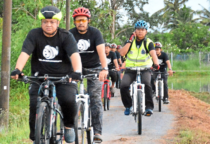 Raja Muda Cycles To Meet The Poor